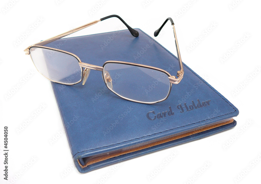 eyeglasses on blue card-holder