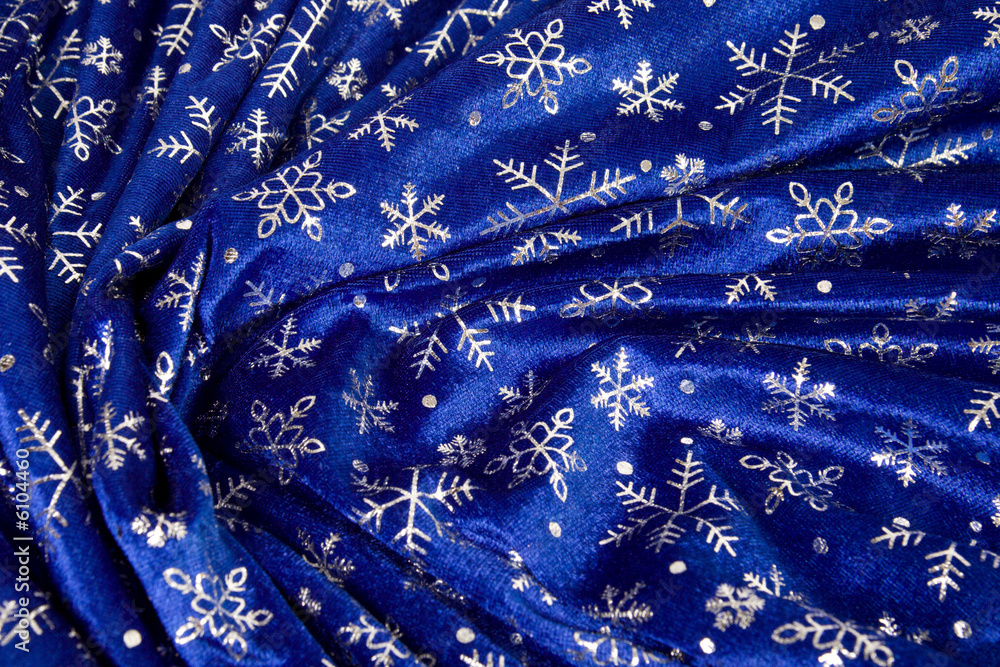 Close-up crumple blue cloth with snowflakes