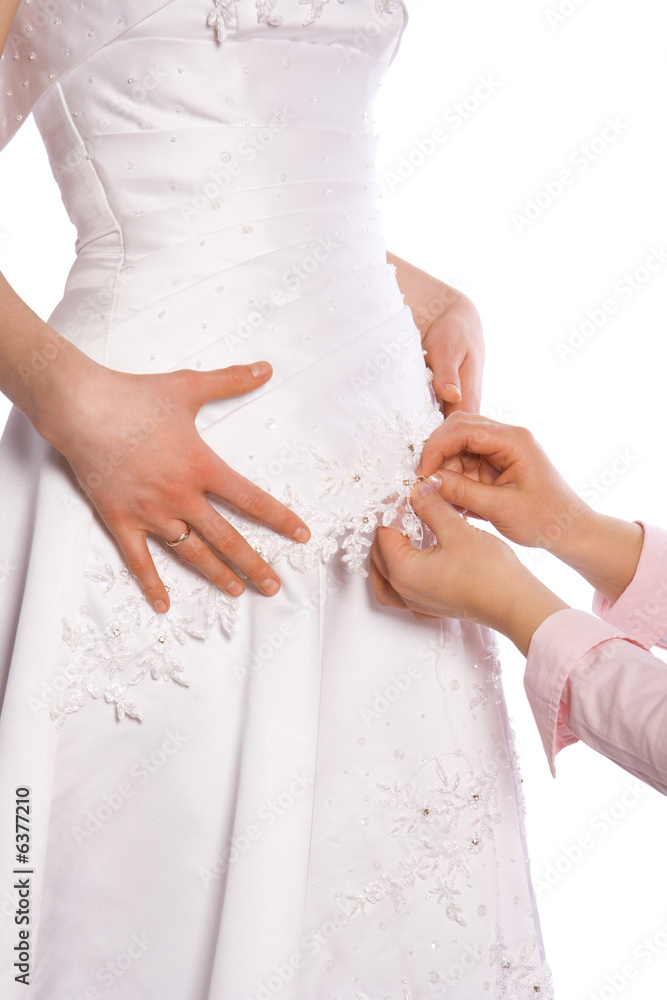 Close-up of tailor sew dress of bride isolated on white