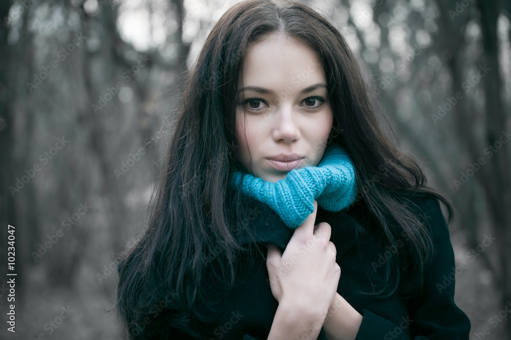 Young woman portrait. Cold autumn season.