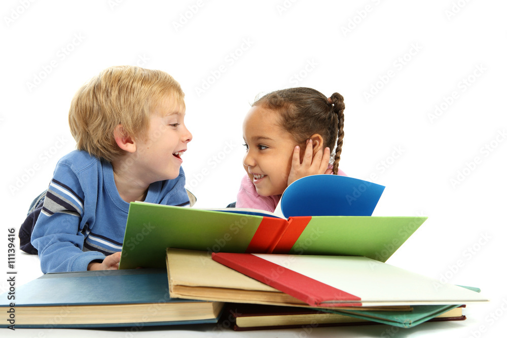 Kids laying down and reading a book