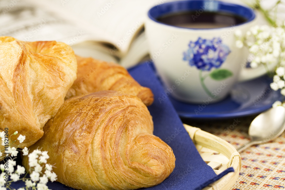 Breakfast with coffee and croissants