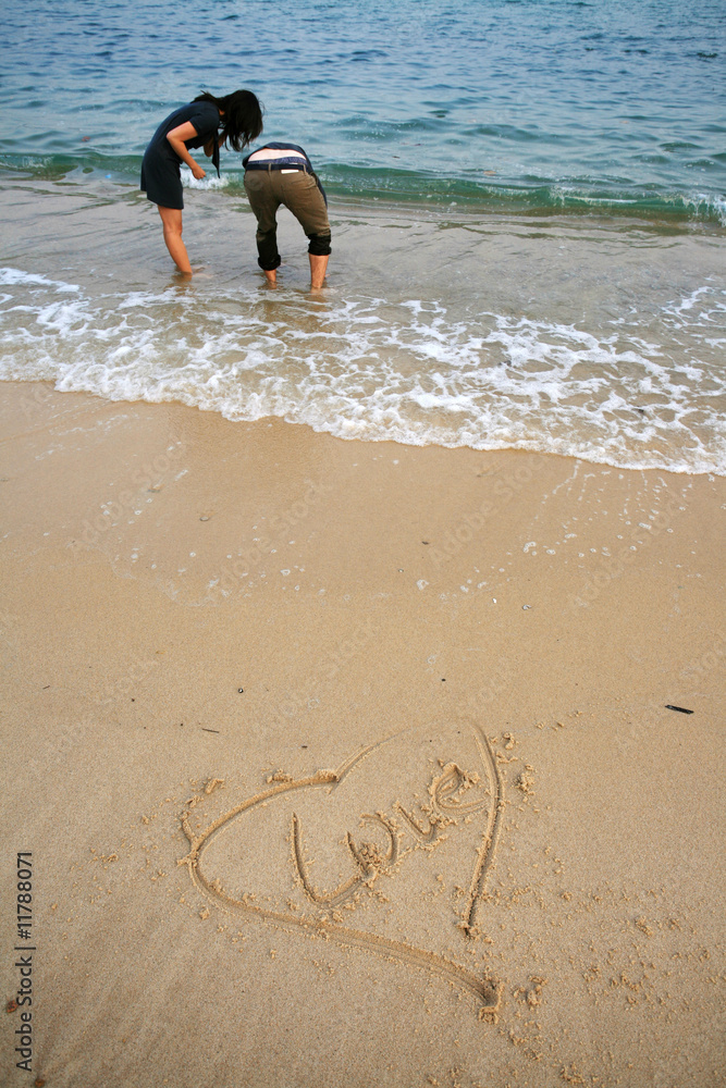 Young attractive couple at the beach