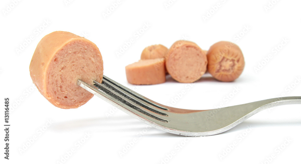 Hot dog sausage slices and fork