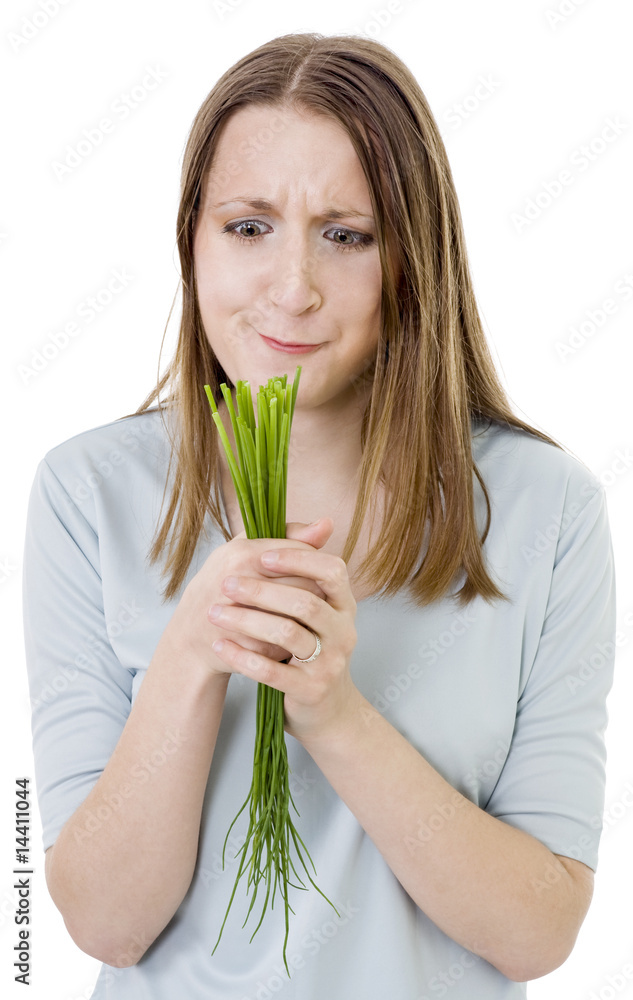 puzzled woman with bunch of grass