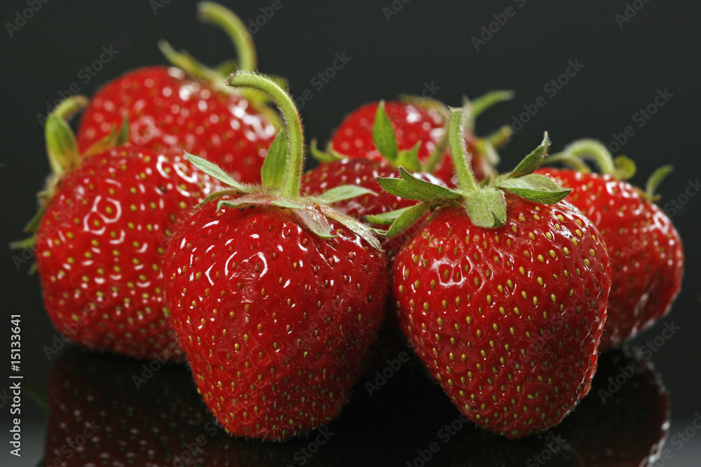 strawberries on black background