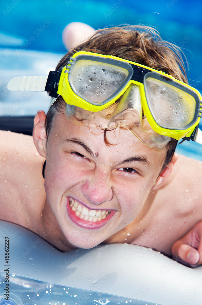 Playful boy in a pool