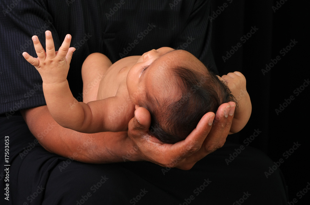 Baby and fathers hands