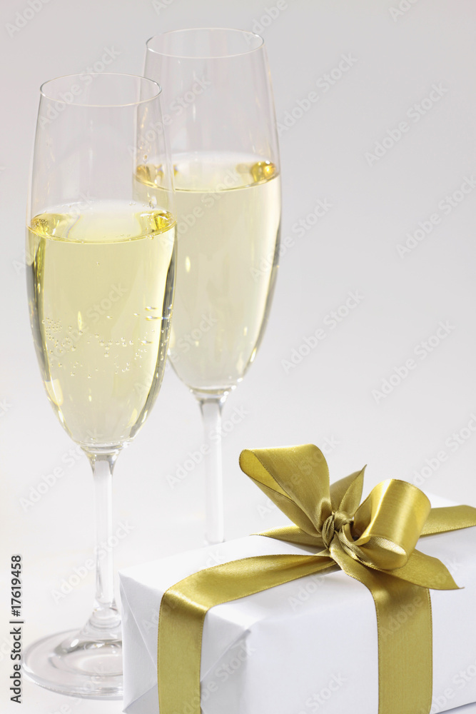 gift and glasses of champagne