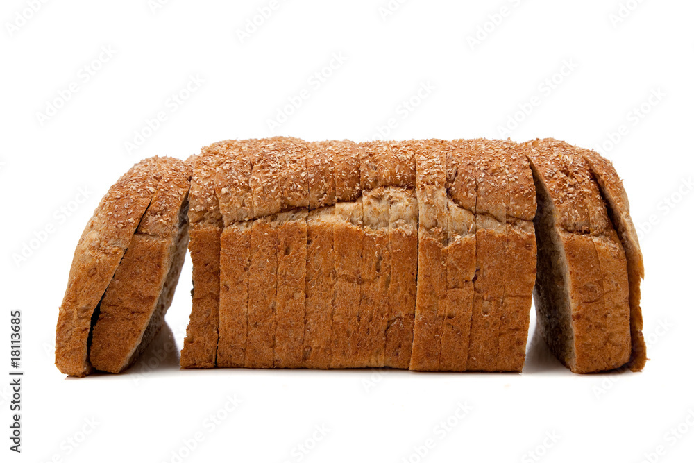 A loaf of whole grain bread on white