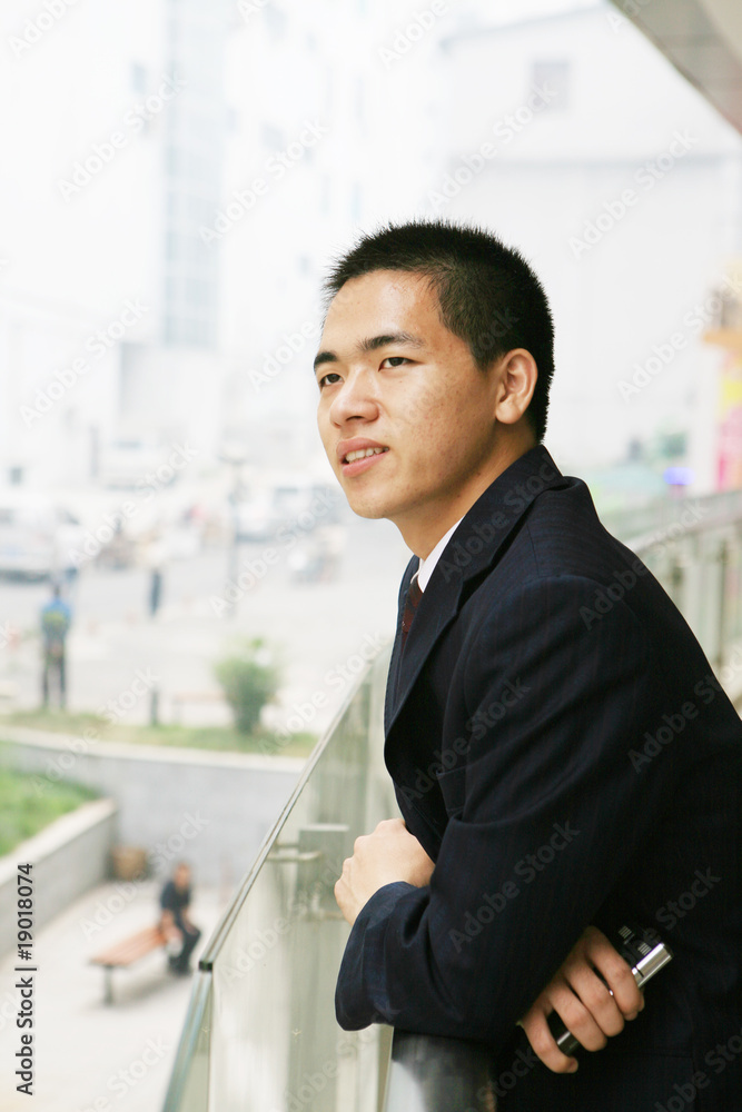 young asian businessman On the Balcony