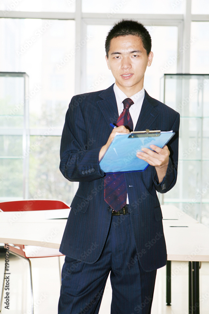 young asian businessman in office