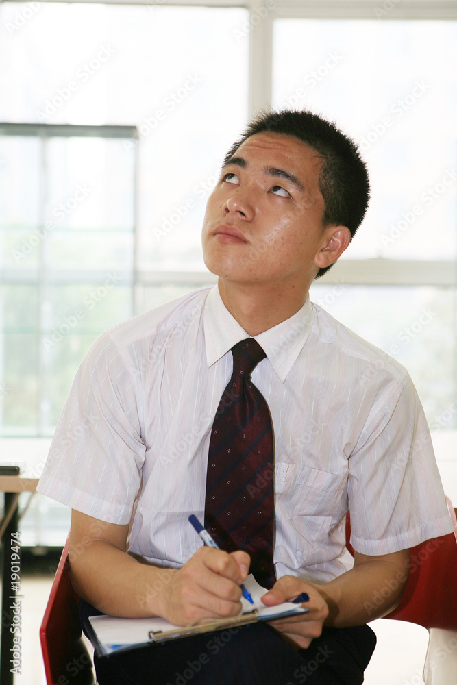 young asian businessman in office