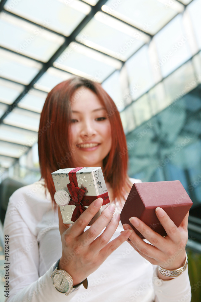 young asian holding wiht gift box