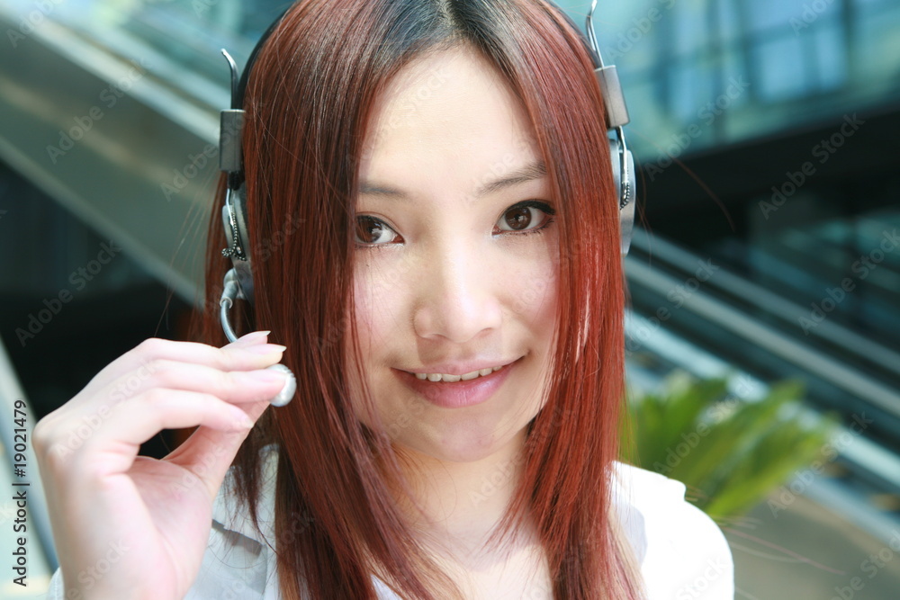 Beautiful Customer Representative with headset smiling