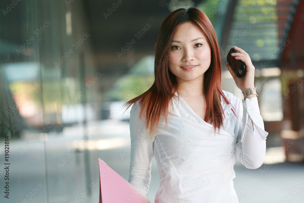 Beautiful Customer Representative holding with folder