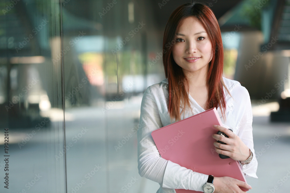 Beautiful Customer Representative holding with folder