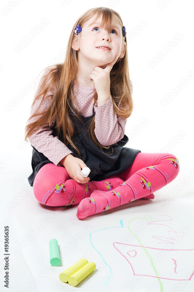 LIttle girl thinking and drawing