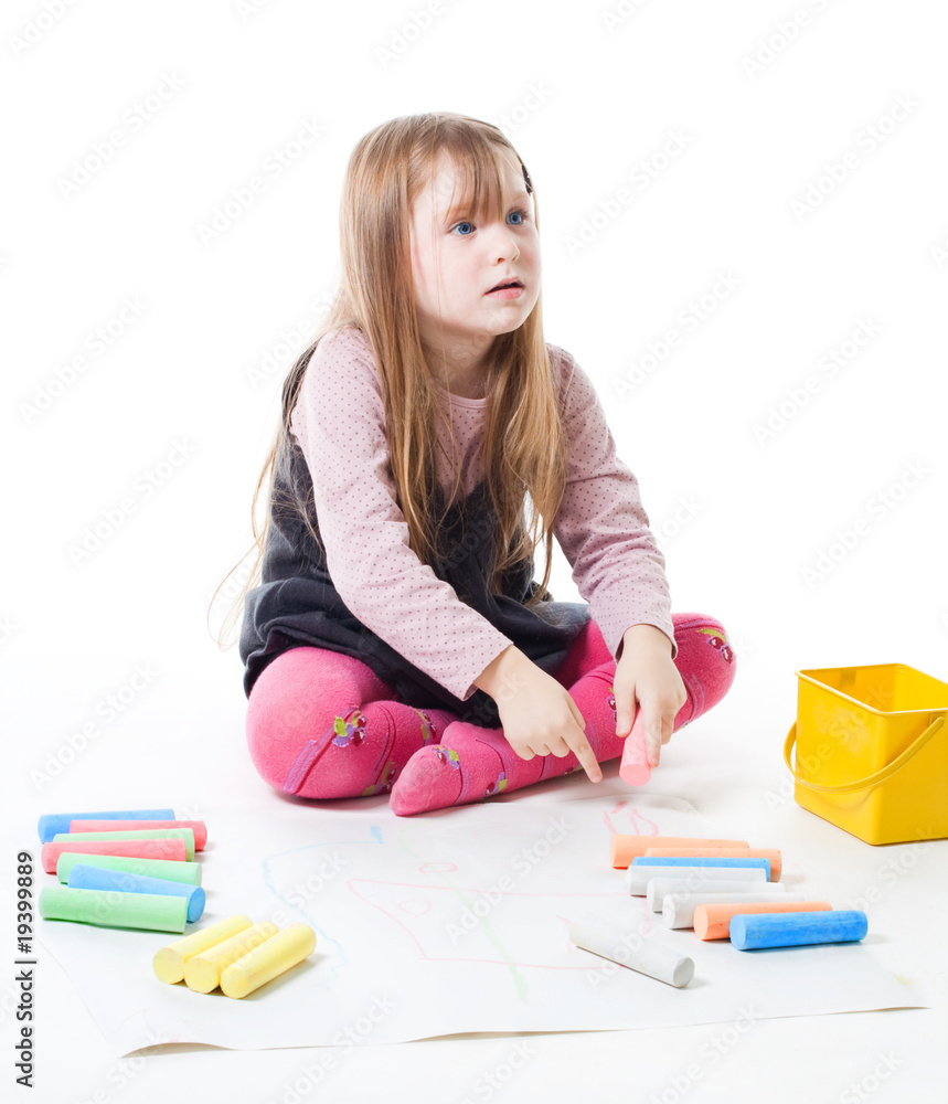 Little girl draw picture with chalk