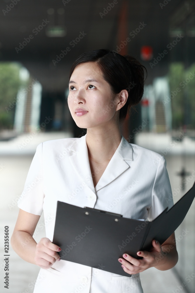 young asian business woman holding with folder