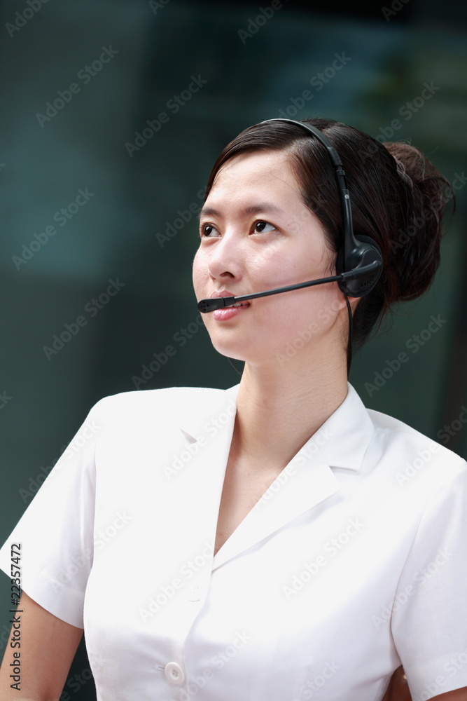 young asian business woman with headset