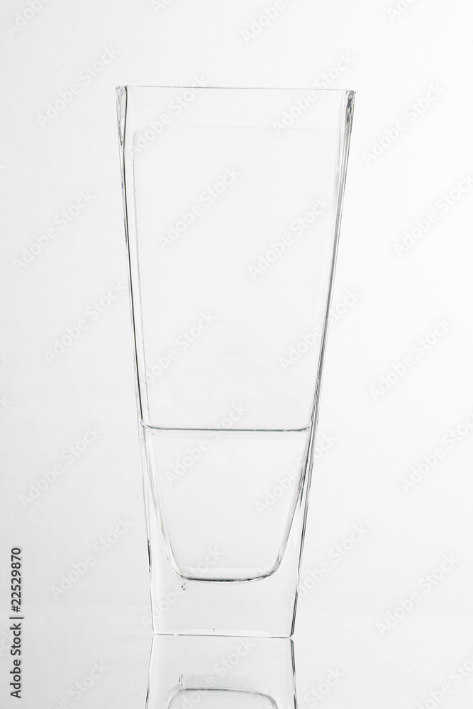 Glass of water half empty isolated on white background ..