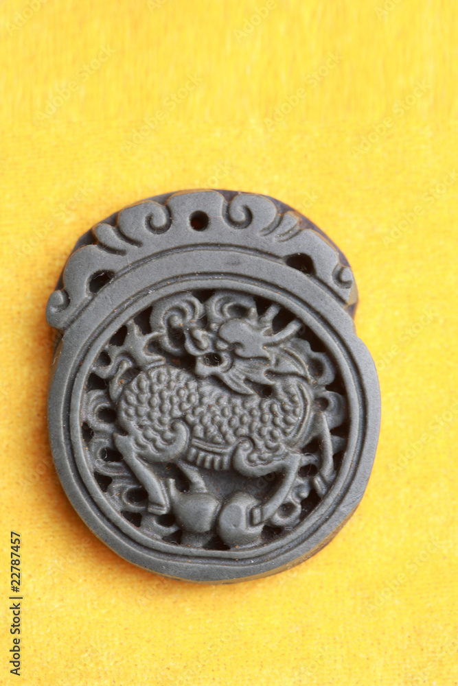 Chinese inkstone isolated on yellow background