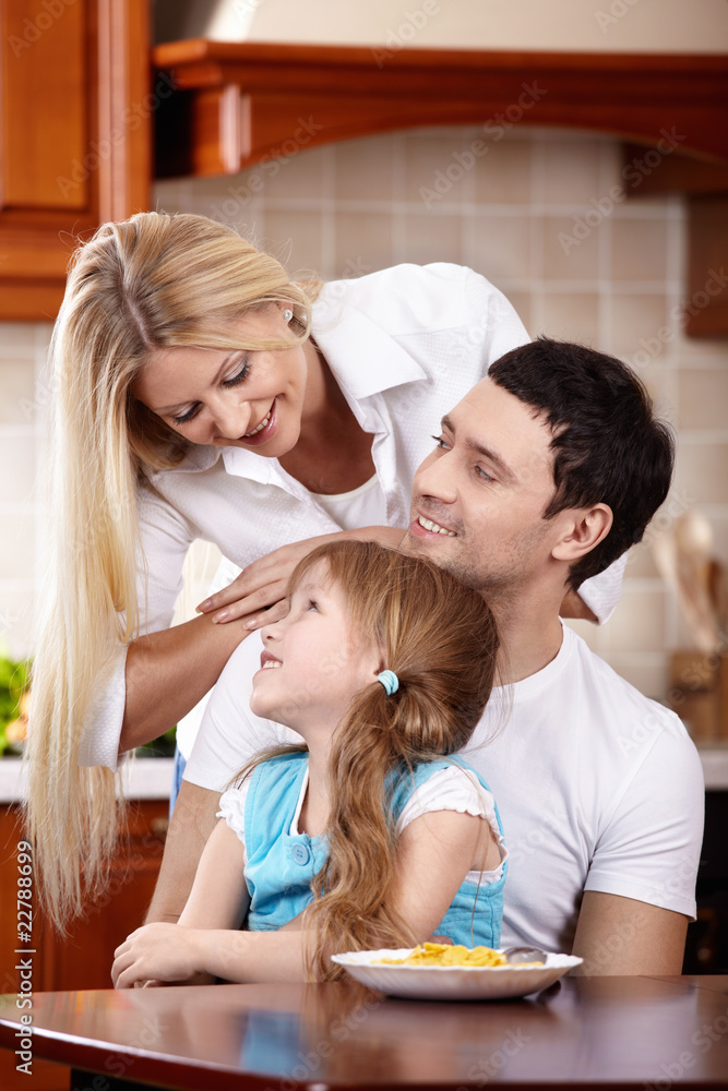 Family with the child on kitchen