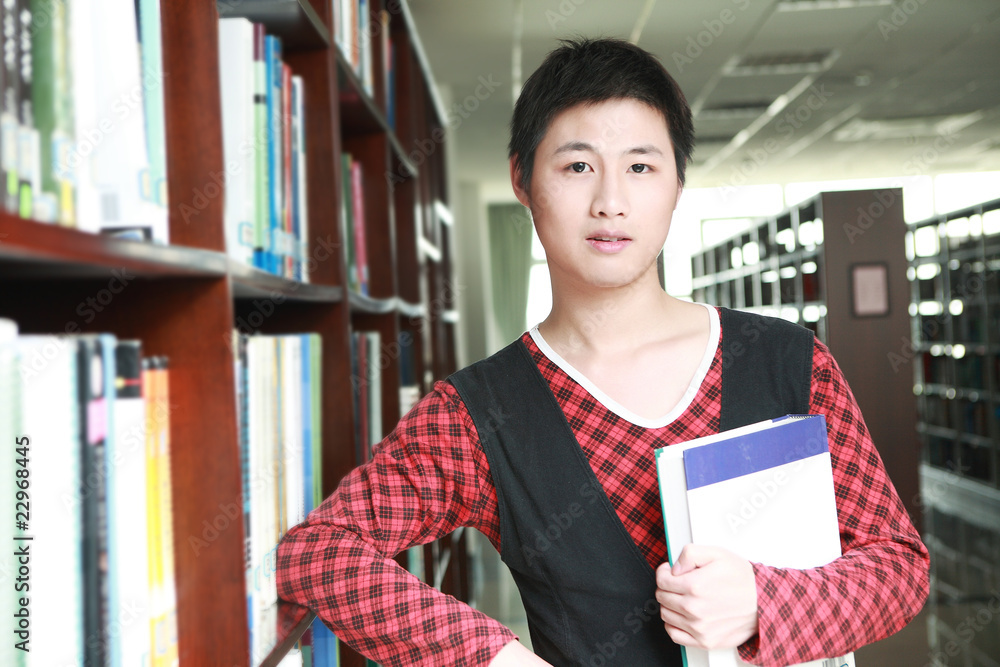 asian boy studying in library