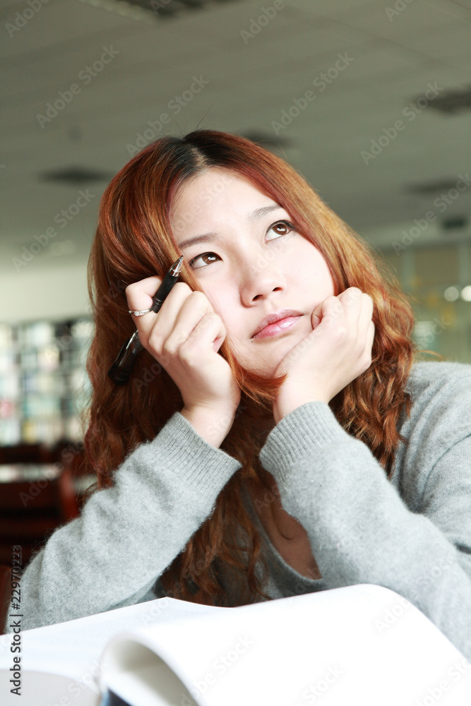 asian girl studying in library