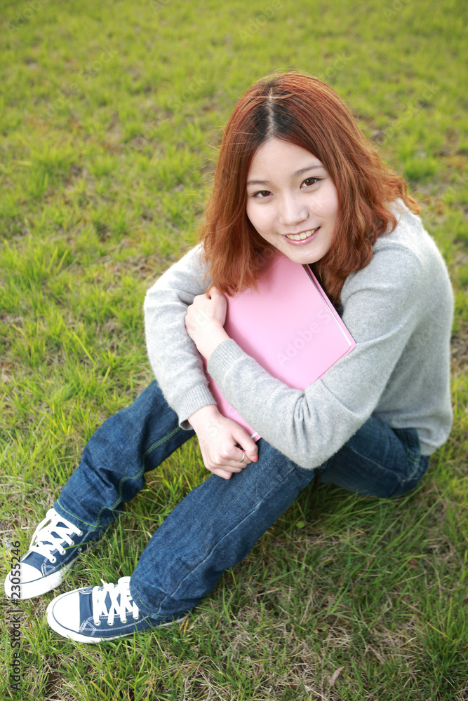 asina reading book on grass