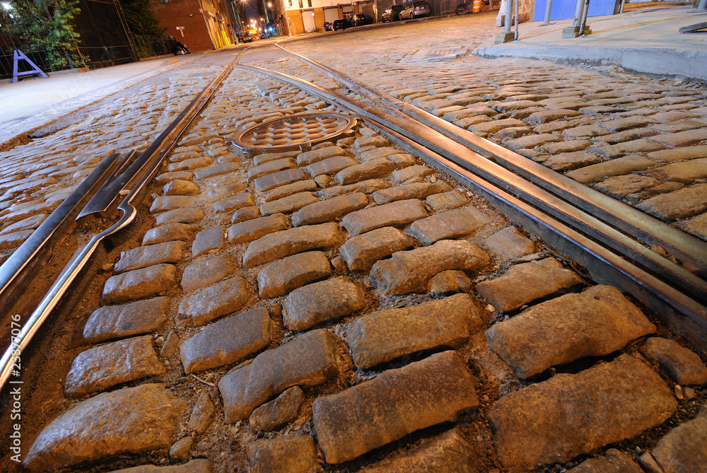 Railroad Tracks and Cobblestone Road