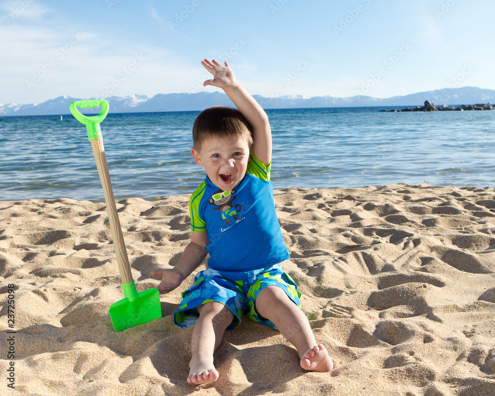 boy having fan on the beach