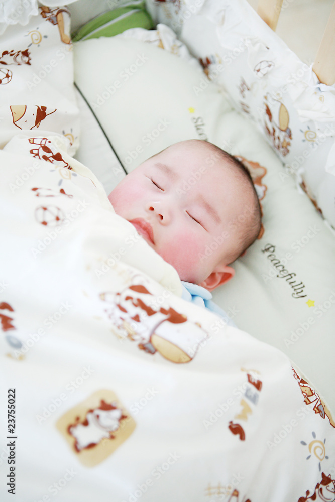 closeup of Cute little baby sleeping in bed