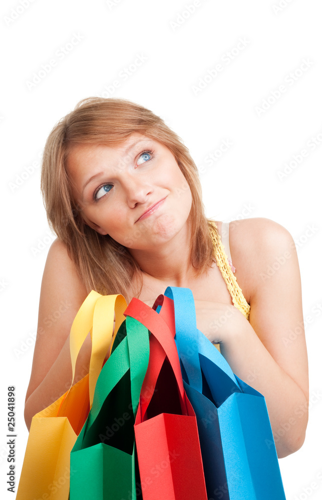 Thinking woman with colorful bags