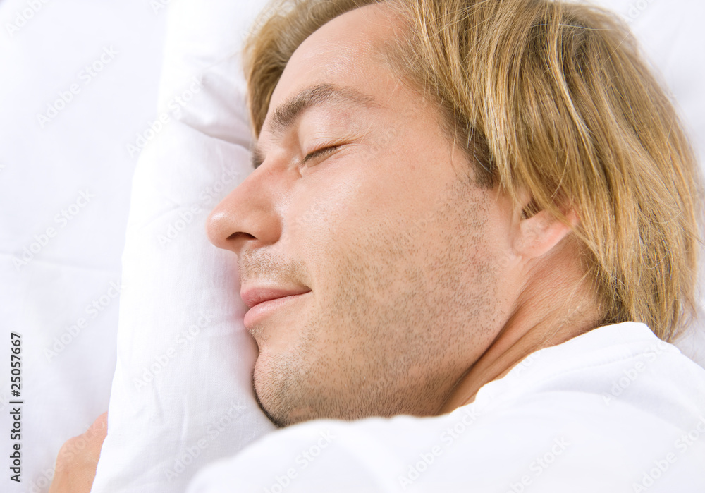 Handsome Man Sleeping in his Bed