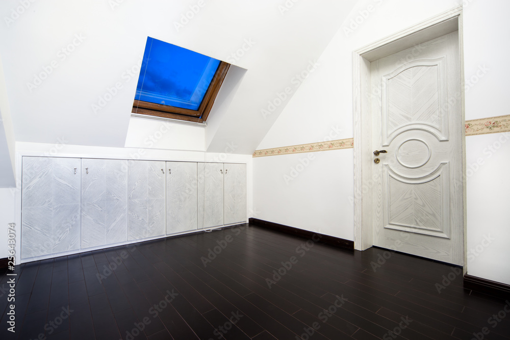 Attic room with roof skylight window