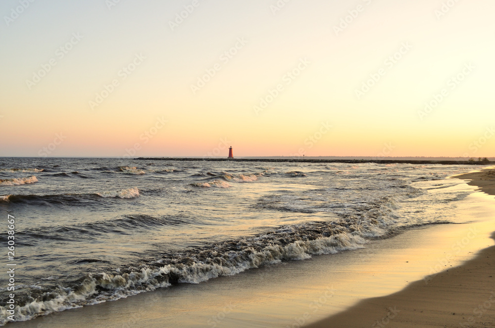 view of the Manistique lighthouse at sunset