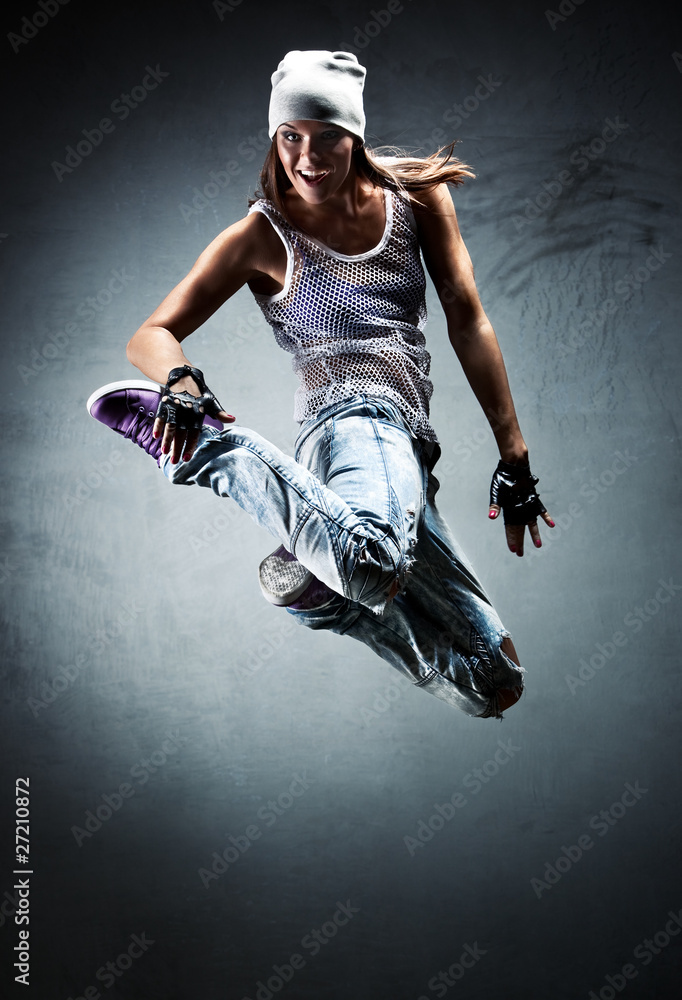 Young woman dancer jumping