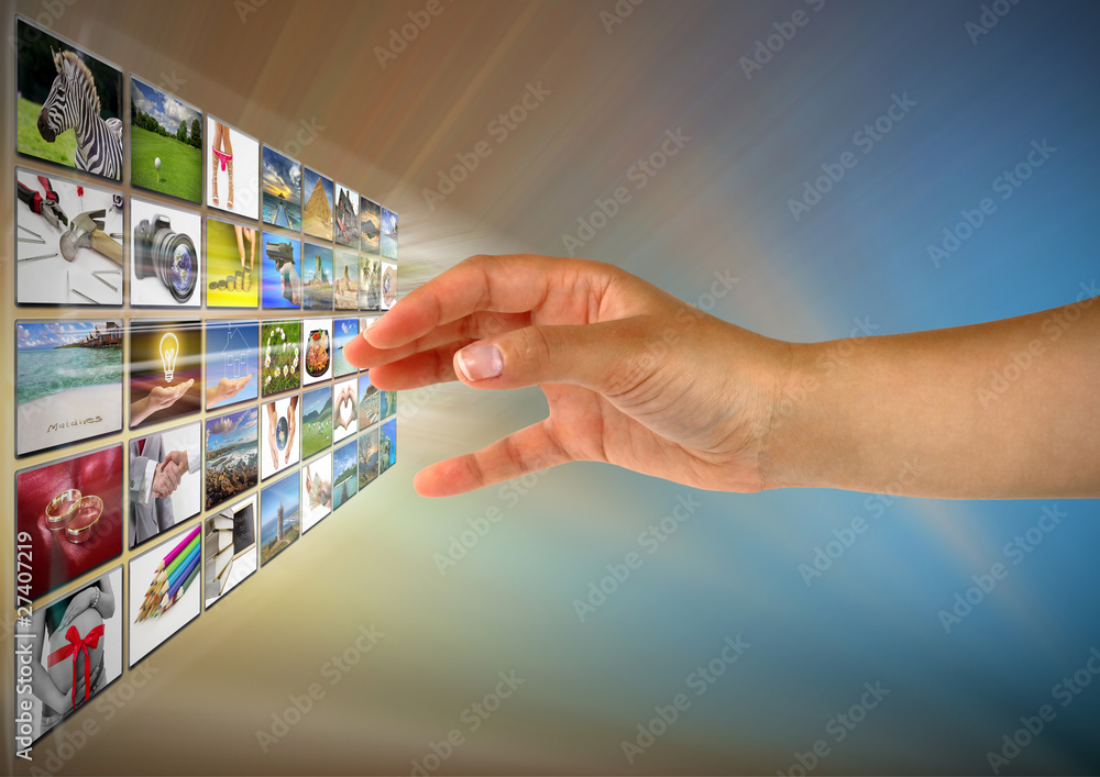 Woman hand reaching images on the screen