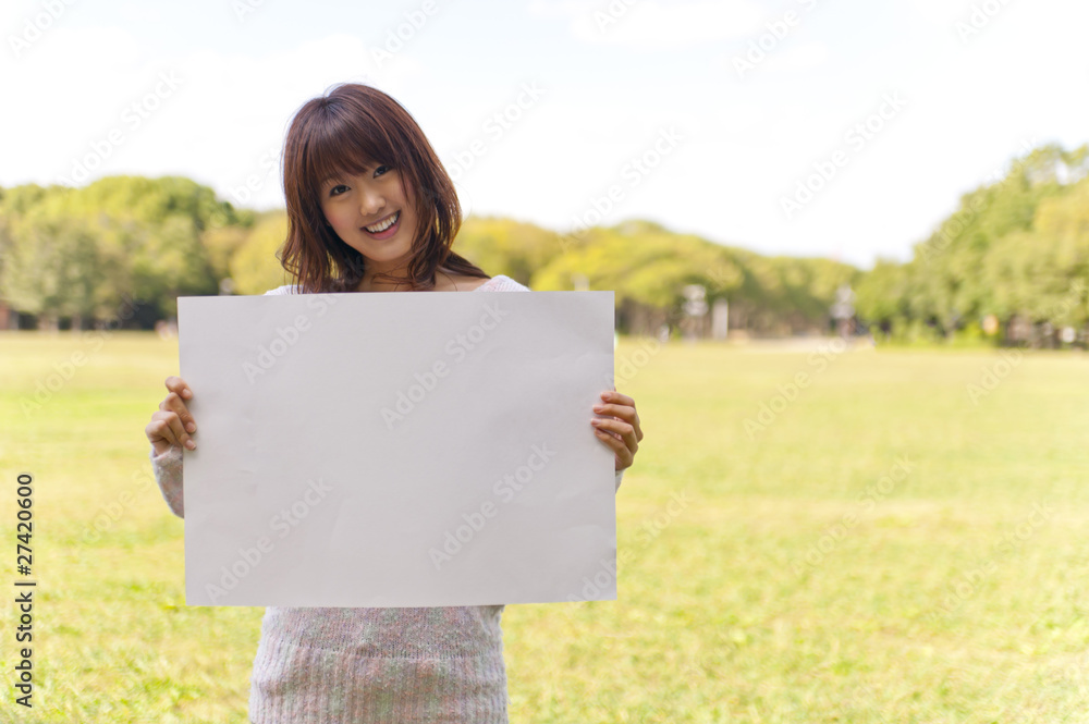 a portrait of young woman has blank whiteboad