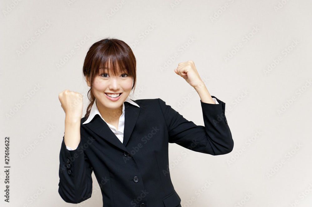 a portrait of young business woman cheering