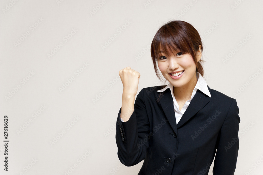 a portrait of young business woman cheering