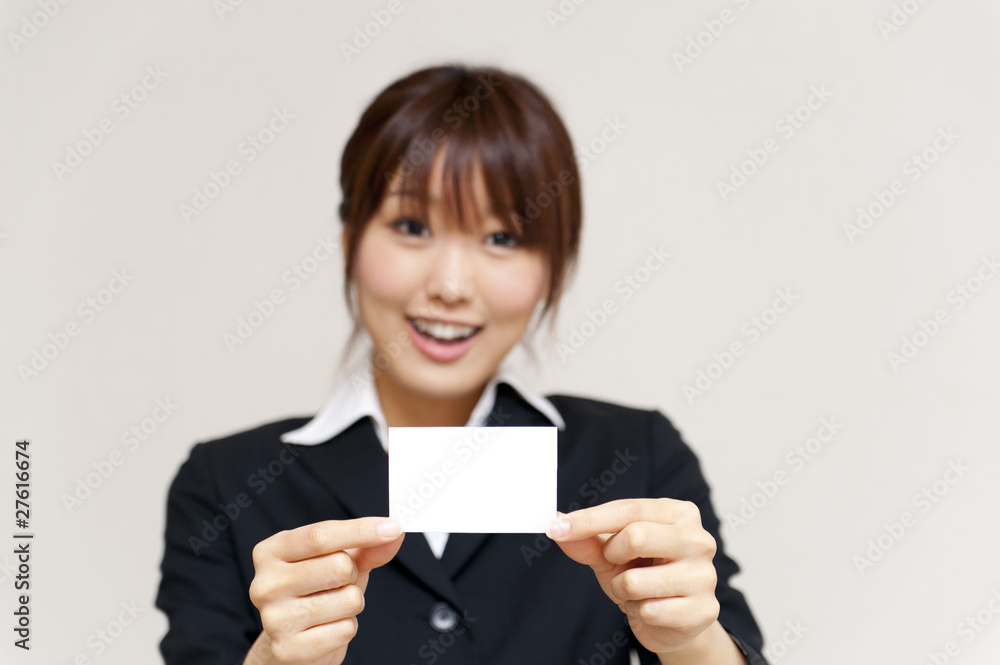 a portrait of young business woman have a card