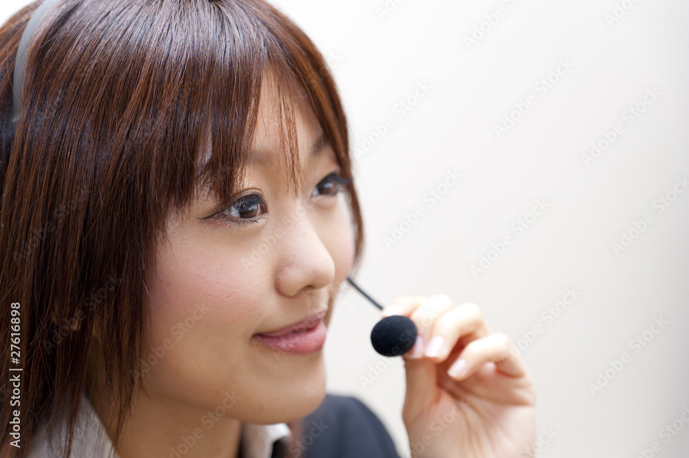 a portrait of young business woman with haedset