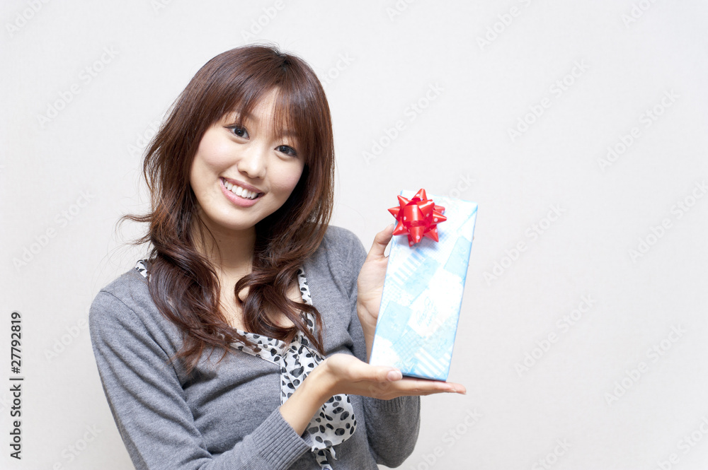 a portrait of beautiful woman taking a present