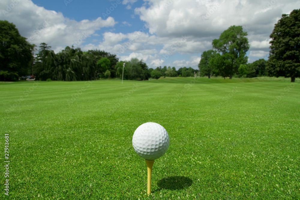 Golf ball on tee in a beautiful golf club