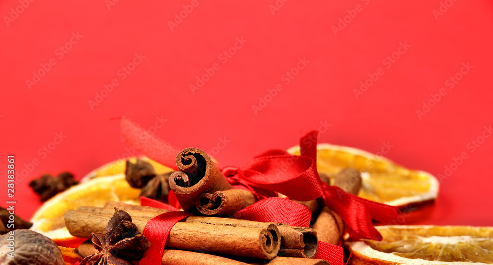 Cinnamon barks and dry orange slices and star anise