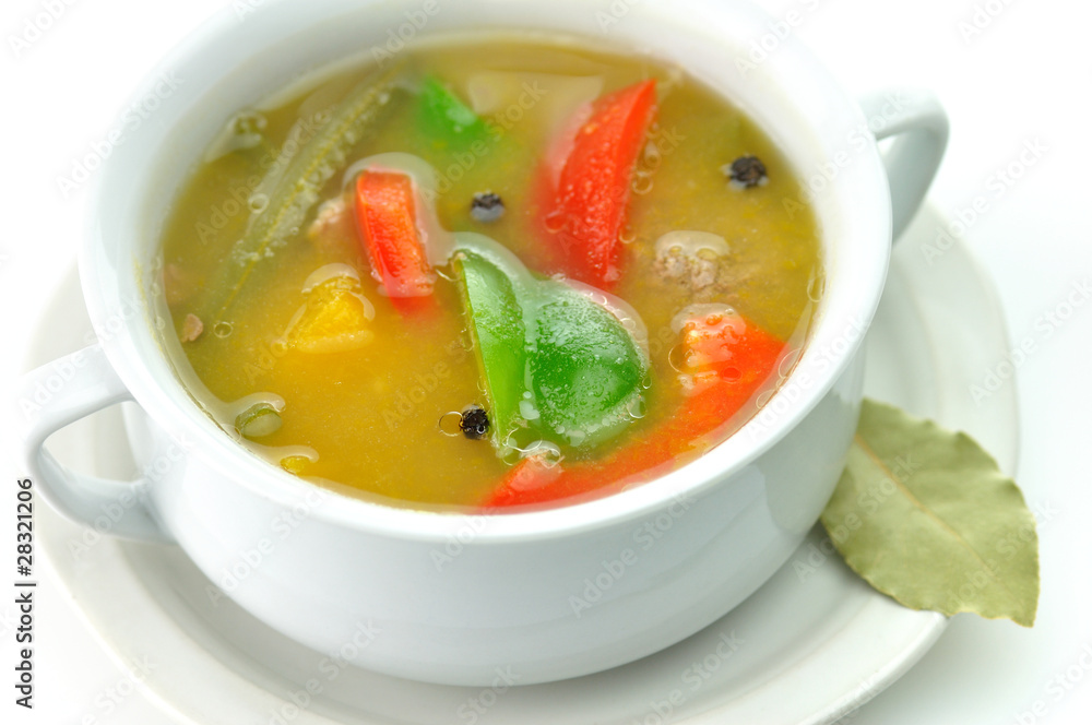 vegetable soup in a white soup cup