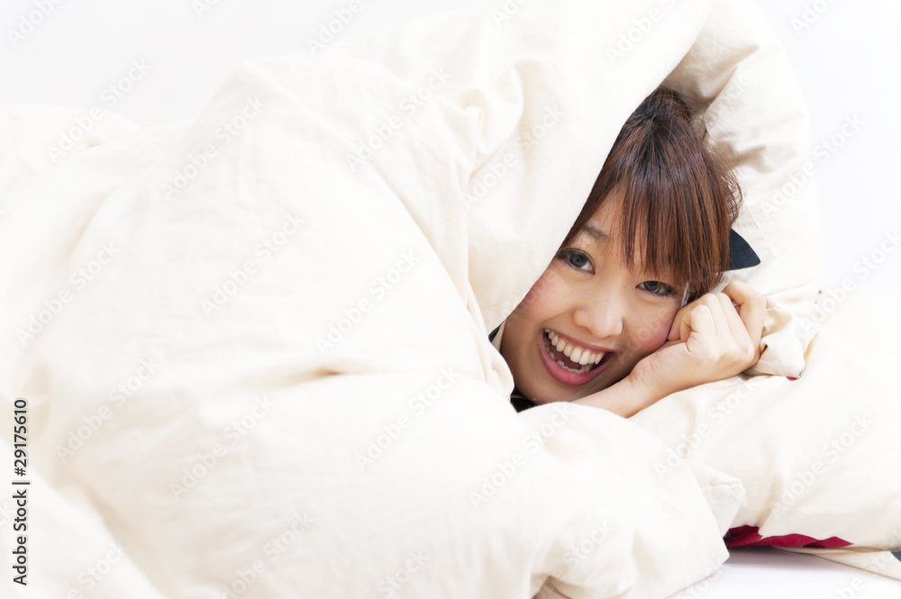 a portrait of beautiful asian woman on the bed